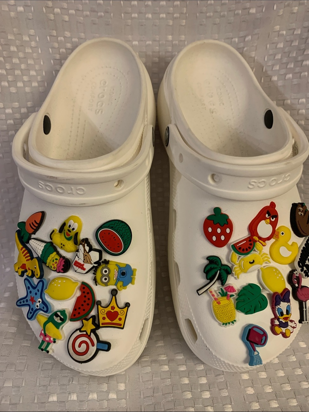 Women’s white platform CROCS  
 with 24 Jibbitz charms included, size 10.